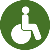 This pictogram shows a person in a wheelchair and stands in the project for the needs of peple who cannot walk.